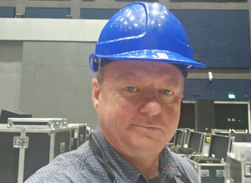 Man wearing blue hard hat